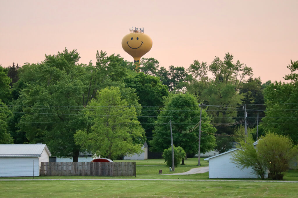 Ashley, Indiana, is known for its yellow smiley face water tower. The Brightmark chemical recycling plant is nearby. Credit: James Bruggers