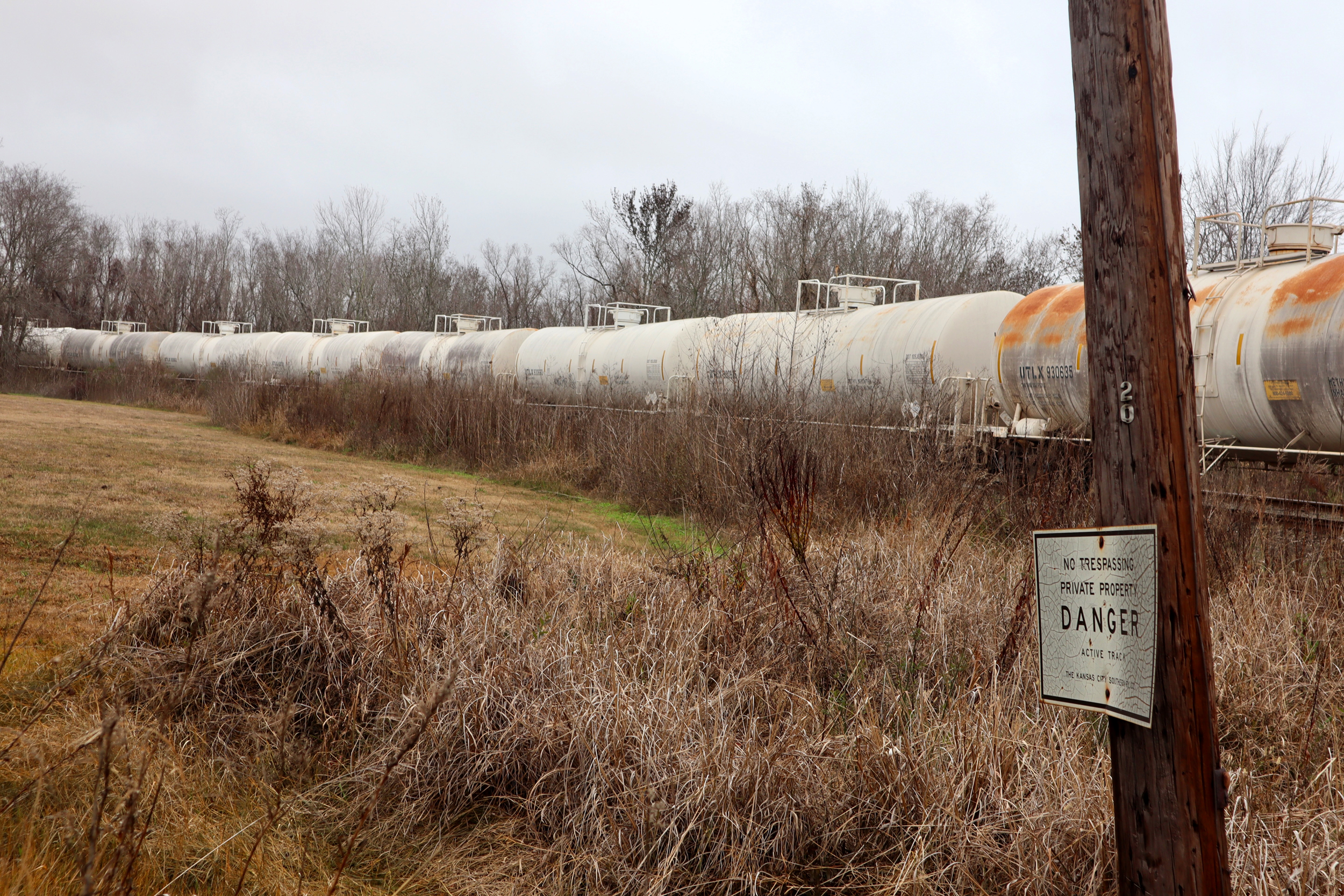 Rail tank cars for hazardous materials are parked along the former back yards of homes and businesses in a residential neighborhood next to the ExxonMobil oil refinery in Beaumont, Texas. Credit: James Bruggers/Inside Climate News